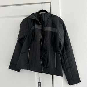 Brand new Aether jacket. inside zipper pockets and hood. Great travel coat!